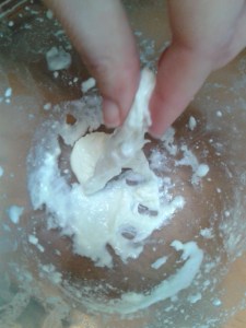 Home-made buffalo mozzarella stretching the curds